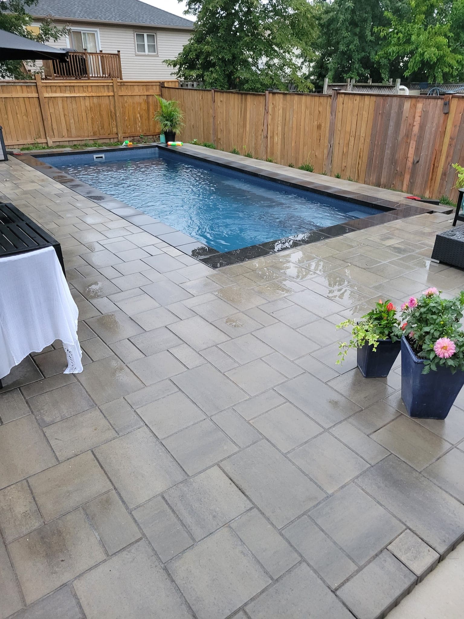 Pool patio with flagstone pavers and planters