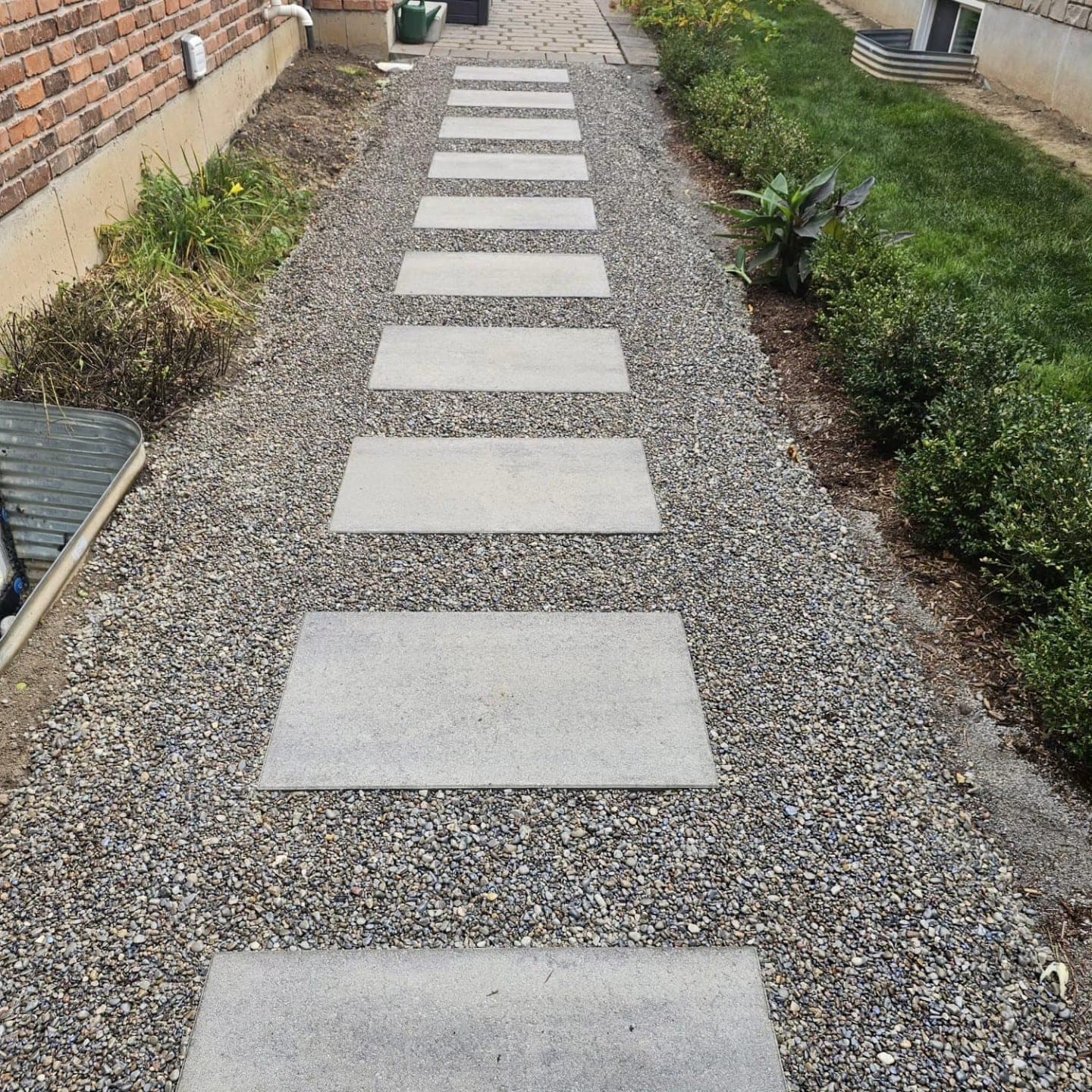 Concrete stepping stones in gravel walkway