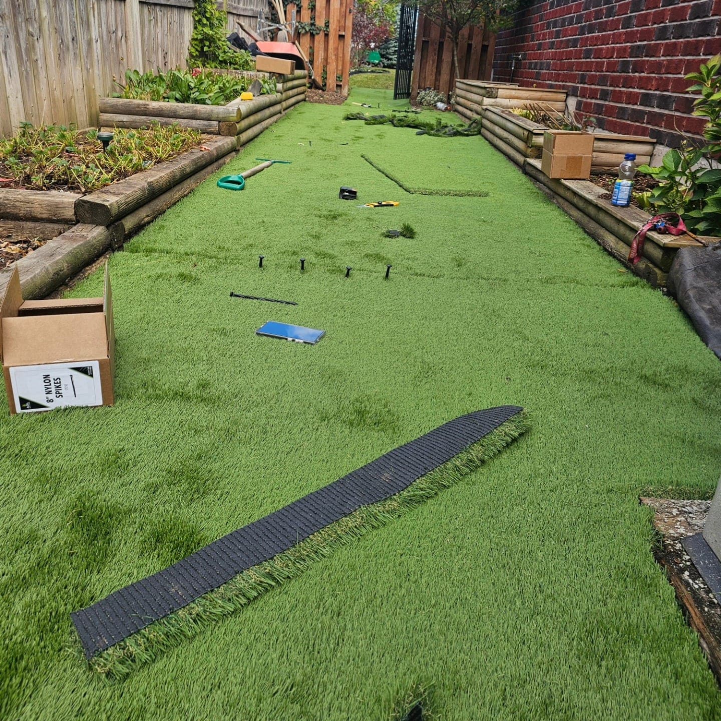 Artificial turf installation with cedar edging